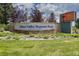 Entrance sign for Dove Valley Regional Park featuring stone accents and lush greenery at 7292 S Blackhawk St # 2-306, Englewood, CO 80112