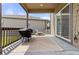 Inviting back patio with barbecue grill, picnic table, and an outdoor rug, perfect for outdoor entertaining at 2040 Rosette Pl, Castle Rock, CO 80104