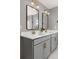 Stylish bathroom featuring a double sink vanity, modern lighting fixtures, and neutral color palette at 2040 Rosette Pl, Castle Rock, CO 80104