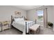Cozy bedroom with neutral walls, a window providing natural light, and comfortable carpet flooring at 2040 Rosette Pl, Castle Rock, CO 80104