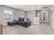 Spacious loft with plush carpet has a couch and access to the bathroom at 2040 Rosette Pl, Castle Rock, CO 80104