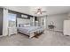 Spacious main bedroom features lots of windows and a neutral color palette at 2040 Rosette Pl, Castle Rock, CO 80104