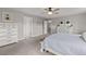 Spacious main bedroom featuring light gray walls, ceiling fan, and plush carpet flooring at 2040 Rosette Pl, Castle Rock, CO 80104