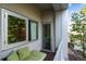 Relaxing balcony with outdoor seating, views of the neighborhood and a glass door to the interior at 2958 Syracuse St # 214, Denver, CO 80238