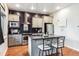 Contemporary kitchen featuring granite countertops, stainless steel appliances, and a center island with seating at 2958 Syracuse St # 214, Denver, CO 80238