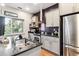 Stylish kitchen with granite countertops, stainless steel appliances, and ample natural light at 2958 Syracuse St # 214, Denver, CO 80238