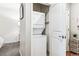 Stacked washer and dryer conveniently located in a closet near the bedroom entrance at 2958 Syracuse St # 214, Denver, CO 80238