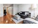 Comfortable living room with hardwood floors, neutral decor, and plenty of natural light at 2958 Syracuse St # 214, Denver, CO 80238