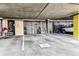 Well-lit parking garage features private storage and assigned parking, providing secure and convenient parking at 2958 Syracuse St # 214, Denver, CO 80238