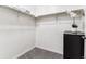 Walk-in closet with rod, shelf, dark cabinet and gray carpet at 2958 Syracuse St # 214, Denver, CO 80238