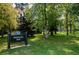Lush green space at Observatory Park, Denver, with mature trees and manicured lawns at 2000 S Columbine St, Denver, CO 80210