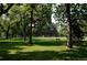 Scenic view of Observatory Park featuring mature trees, green lawns, and a serene atmosphere at 2000 S Columbine St, Denver, CO 80210