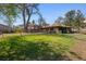 Wide view of this home's expansive lawn and leafy tree coverage at 2000 S Columbine St, Denver, CO 80210