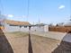 Expansive backyard featuring a shed, grassy area and long, concrete driveway at 4842 Steele St, Denver, CO 80216