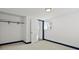 Bright closet area with a sturdy rod, a window for natural light, and a crisp white door for privacy at 4842 Steele St, Denver, CO 80216