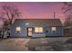 Charming blue single-story home with a well-maintained front yard and long driveway at 4842 Steele St, Denver, CO 80216
