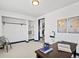 Office space with a closet, a stylish desk, a geometric centerpiece, and a modern world map on the wall at 4842 Steele St, Denver, CO 80216