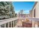 Private balcony offering a view of nearby buildings and mature trees in the neighborhood at 7973 Chase Cir # 56, Arvada, CO 80003