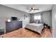 Bedroom featuring wood floors, ceiling fan, and modern decor at 7973 Chase Cir # 56, Arvada, CO 80003