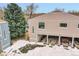 Tan two-story building with attached garages and a balcony at 7973 Chase Cir # 56, Arvada, CO 80003
