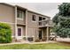 Two-story townhome with lawn and balcony, offering a cozy and inviting curb appeal at 7973 Chase Cir # 56, Arvada, CO 80003