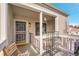 Welcoming front porch with charming details and space for outdoor seating and potted plants at 7973 Chase Cir # 56, Arvada, CO 80003