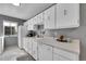 Well-maintained kitchen with white cabinets, appliances, and plenty of counter space with natural light at 7973 Chase Cir # 56, Arvada, CO 80003