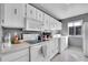 Well-lit kitchen with white cabinets and modern appliances, perfect for cooking enthusiasts at 7973 Chase Cir # 56, Arvada, CO 80003