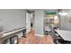 Office with wood floors, lighting, and piano at 7973 Chase Cir # 56, Arvada, CO 80003