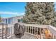 Cozy patio area with a grill, seating and view of trees providing a relaxing outdoor space at 7973 Chase Cir # 56, Arvada, CO 80003