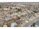 Expansive aerial view of a residential neighborhood with mature trees and varied home styles at 1308 W 102Nd Ave, Northglenn, CO 80260