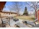 Inviting backyard with a fire pit, lounge chairs, and stylish outdoor seating for relaxation and entertaining at 1308 W 102Nd Ave, Northglenn, CO 80260