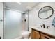 Modern bathroom features a glass-enclosed shower and a stylish vanity, creating a sleek and functional space at 1308 W 102Nd Ave, Northglenn, CO 80260