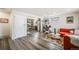 Open-concept living room and kitchen with stylish furniture and wood floors at 1308 W 102Nd Ave, Northglenn, CO 80260