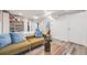 Cozy living room with a comfortable couch, hardwood floors, and a large bookshelf creates a relaxing atmosphere at 1308 W 102Nd Ave, Northglenn, CO 80260