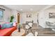 Bright and airy open-concept living space with wood floors and a seating area at 1308 W 102Nd Ave, Northglenn, CO 80260