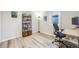 Well-lit office space with hardwood floors, a large desk, and ample storage creates a productive work environment at 1308 W 102Nd Ave, Northglenn, CO 80260