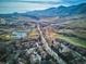 Wide shot of community, golf course, and mountain range at 1060 Cottonwood Cir, Golden, CO 80401