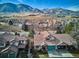 Aerial view of homes, streets, and mountain views at 1060 Cottonwood Cir, Golden, CO 80401