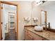 Bathroom with granite countertop, vessel sink, and walk-in closet at 1060 Cottonwood Cir, Golden, CO 80401