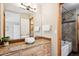 Bathroom with granite countertop, vessel sink, and shower/tub combo at 1060 Cottonwood Cir, Golden, CO 80401