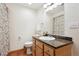 Bathroom with granite countertop, sink, and shower at 1060 Cottonwood Cir, Golden, CO 80401