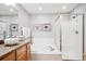 Main bathroom with granite vanity, soaking tub and walk-in shower at 1060 Cottonwood Cir, Golden, CO 80401