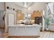 Spacious kitchen with light wood cabinets and granite island at 1060 Cottonwood Cir, Golden, CO 80401