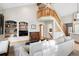 Living room with built-in shelving, hardwood floors, and a view of the upper level at 1060 Cottonwood Cir, Golden, CO 80401