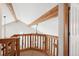 Open loft area with wood railings and beams at 1060 Cottonwood Cir, Golden, CO 80401