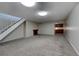 Finished basement with a fireplace and staircase at 4266 W Pondview Dr, Littleton, CO 80123