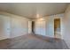 Well-lit bedroom with carpet flooring and access to a bathroom at 4266 W Pondview Dr, Littleton, CO 80123