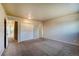 Bright bedroom featuring a large closet and access to a hallway at 4266 W Pondview Dr, Littleton, CO 80123