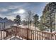 Deck overlooking a serene landscape with trees and water at 4266 W Pondview Dr, Littleton, CO 80123